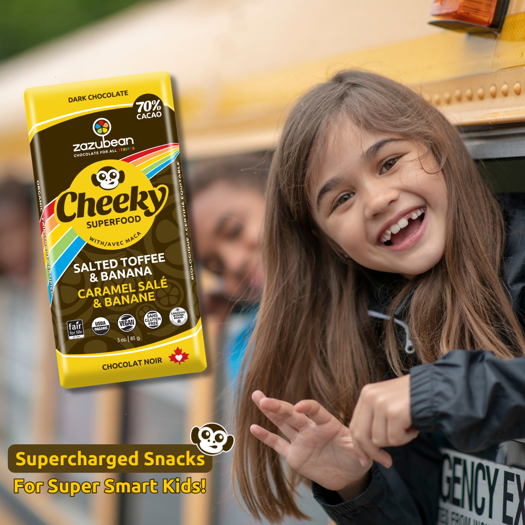 Smiling child with a Zazubean Cheeky 70% dark chocolate bar, featured as a back-to-school snack idea